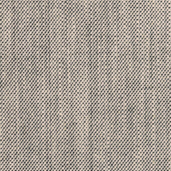 Woven textile sample, dark gray and beige geometric pattern, dense nubby texture, light beige background, vertical line detail, matte finish.